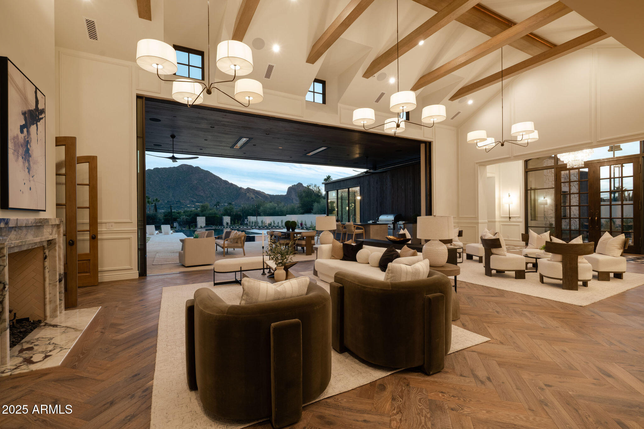 5902 East Cactus Wren Road Paradise Valley, AZ 85253 - Photo 17 of 72 a living room with furniture a fireplace and a flat screen tv