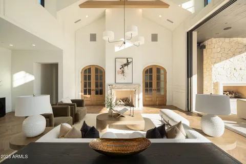 a living room with furniture lamp and a rug