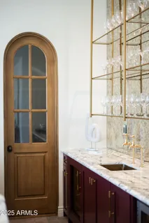 a view of a bedroom with a window and wooden floor