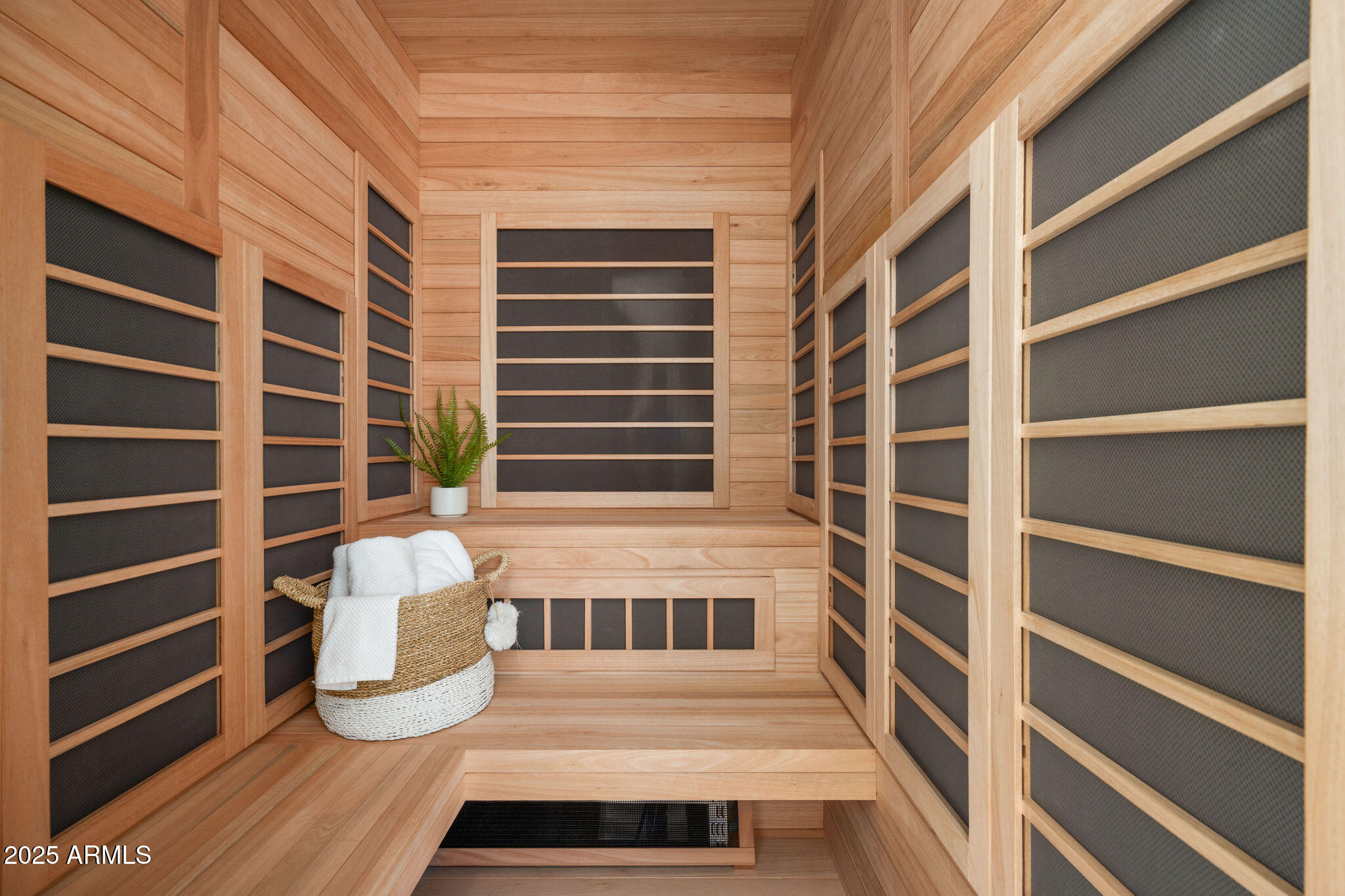 5902 East Cactus Wren Road Paradise Valley, AZ 85253 - Photo 33 of 72 a view of a bedroom with a window and wooden floor