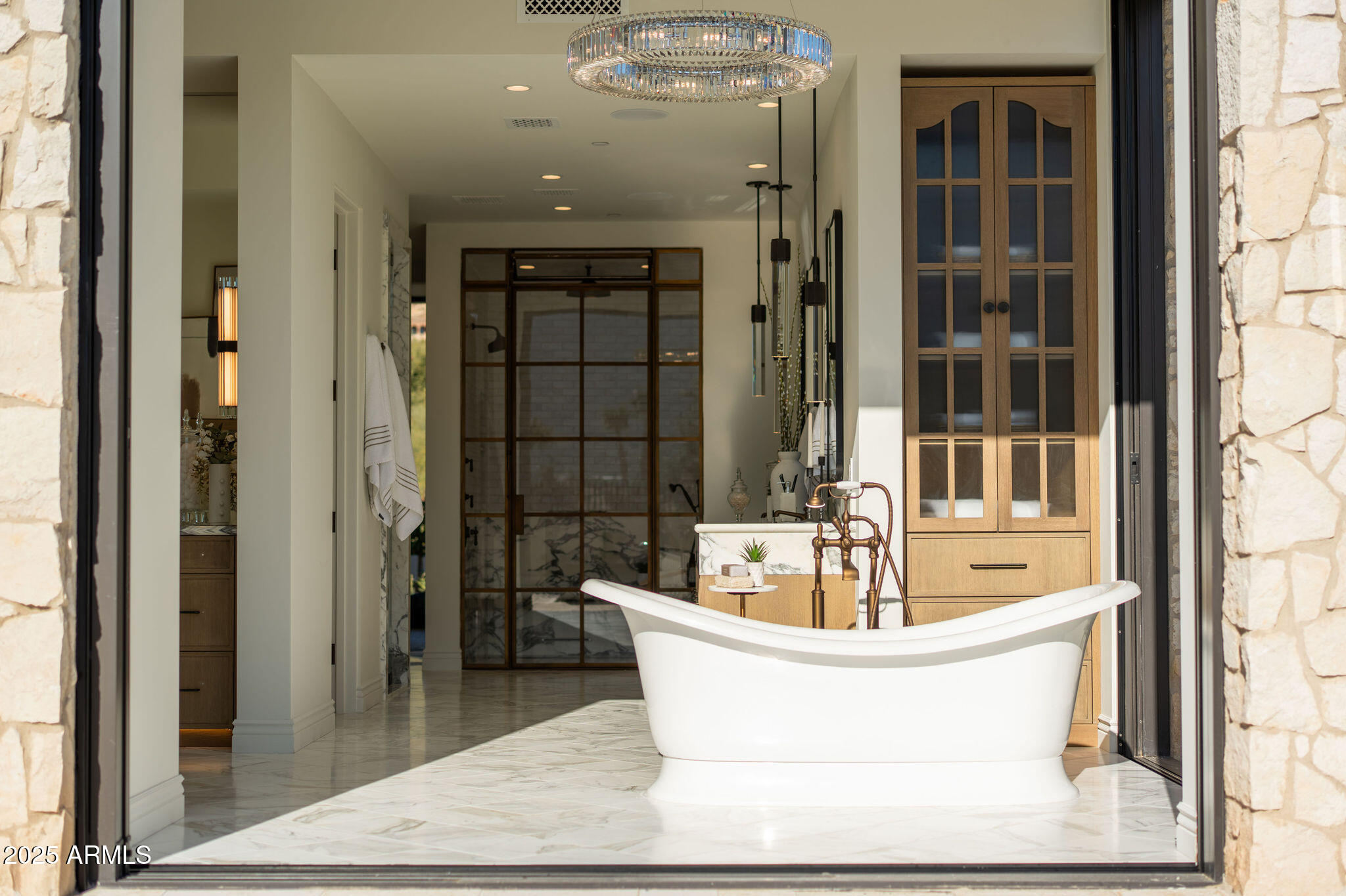 5902 East Cactus Wren Road Paradise Valley, AZ 85253 - Photo 35 of 72 a white bath tub sitting in a bathroom and mirror