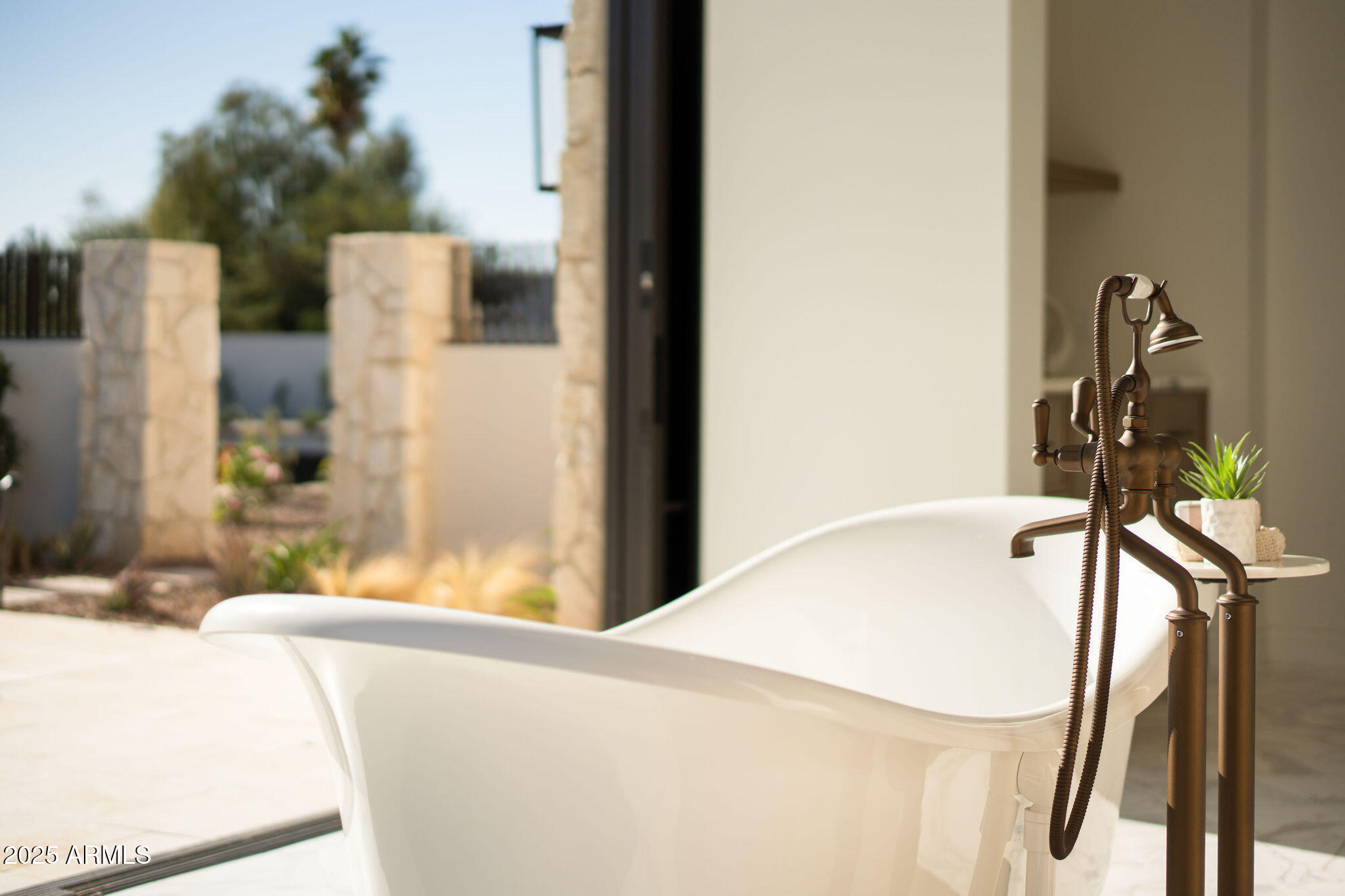 5902 East Cactus Wren Road Paradise Valley, AZ 85253 - Photo 36 of 72 a bath tub sitting next to a bathroom sink