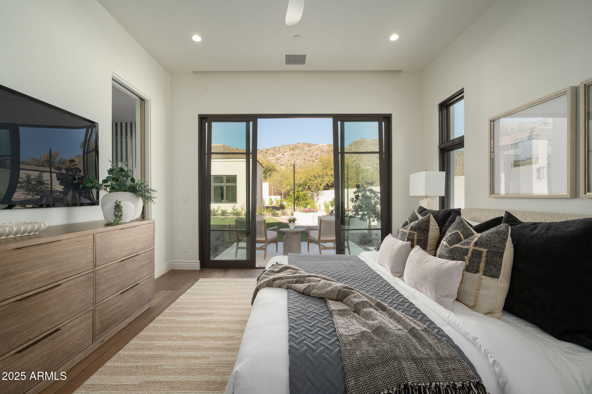 5902 East Cactus Wren Road Paradise Valley, AZ 85253 - Photo 46 of 72 a large bedroom with a large bed and a large window