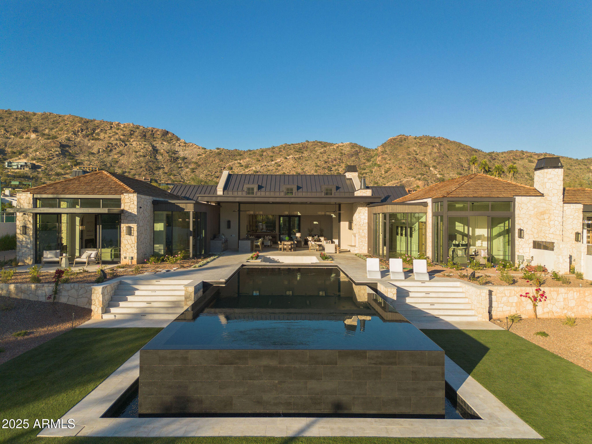 5902 East Cactus Wren Road Paradise Valley, AZ 85253 - Photo 5 of 72 a front view of house with yard outdoor seating and covered with palm trees