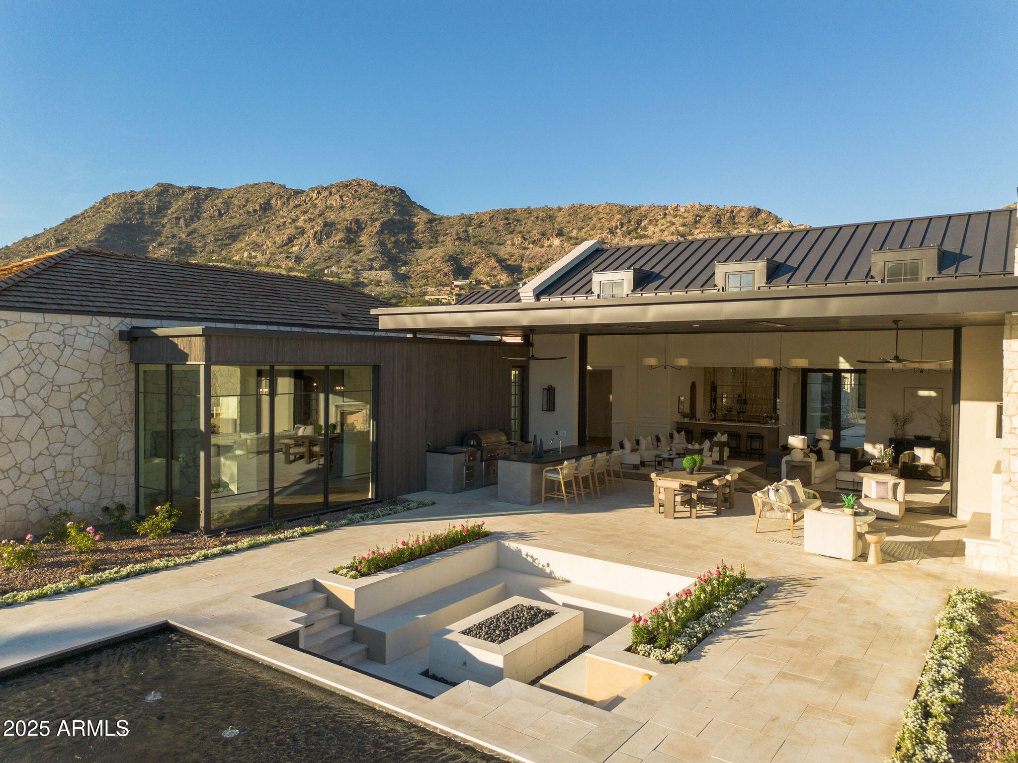 5902 East Cactus Wren Road Paradise Valley, AZ 85253 - Photo 64 of 72 a view of a patio with a table and chairs
