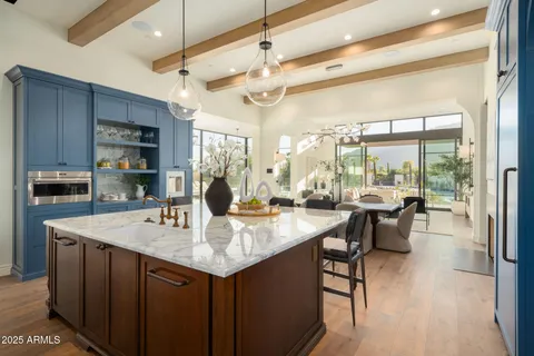 a dining room with furniture garden view and a chandelier