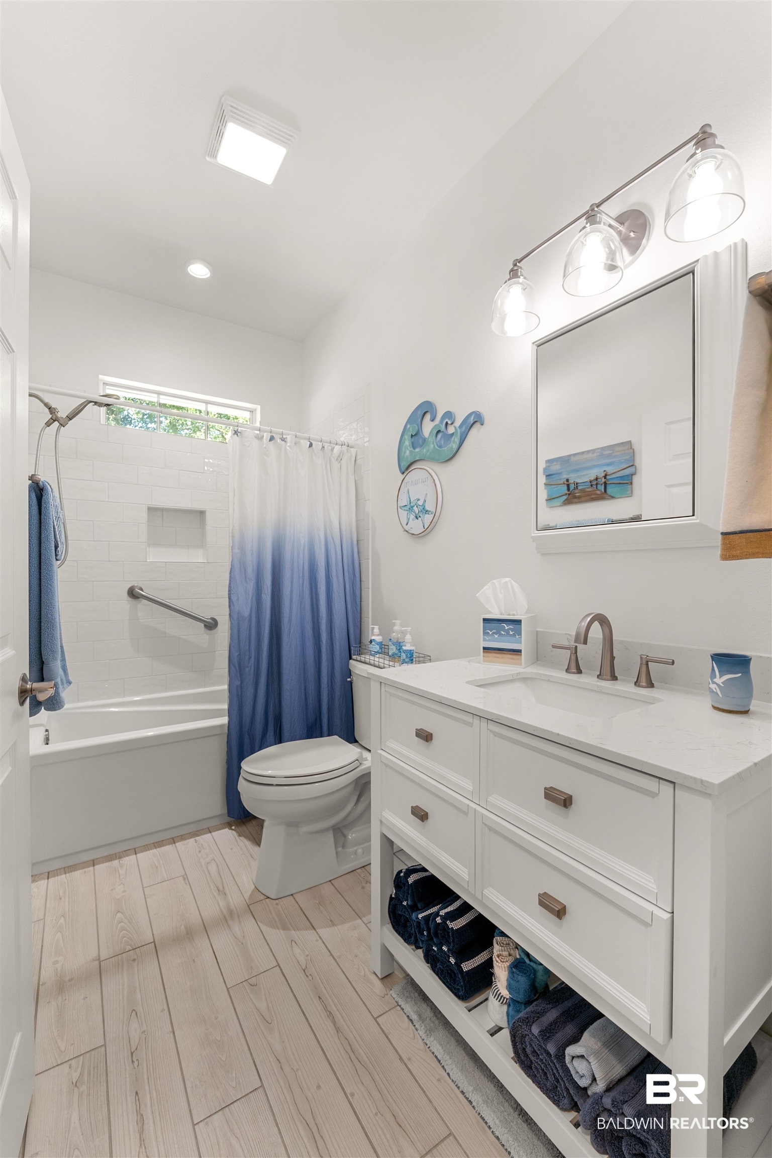 141 Mark Twain Loop Foley, AL 36535 - Photo 24 of 55 Full bathroom with vanity, shower / bath combo with shower curtain, and wood finished floors