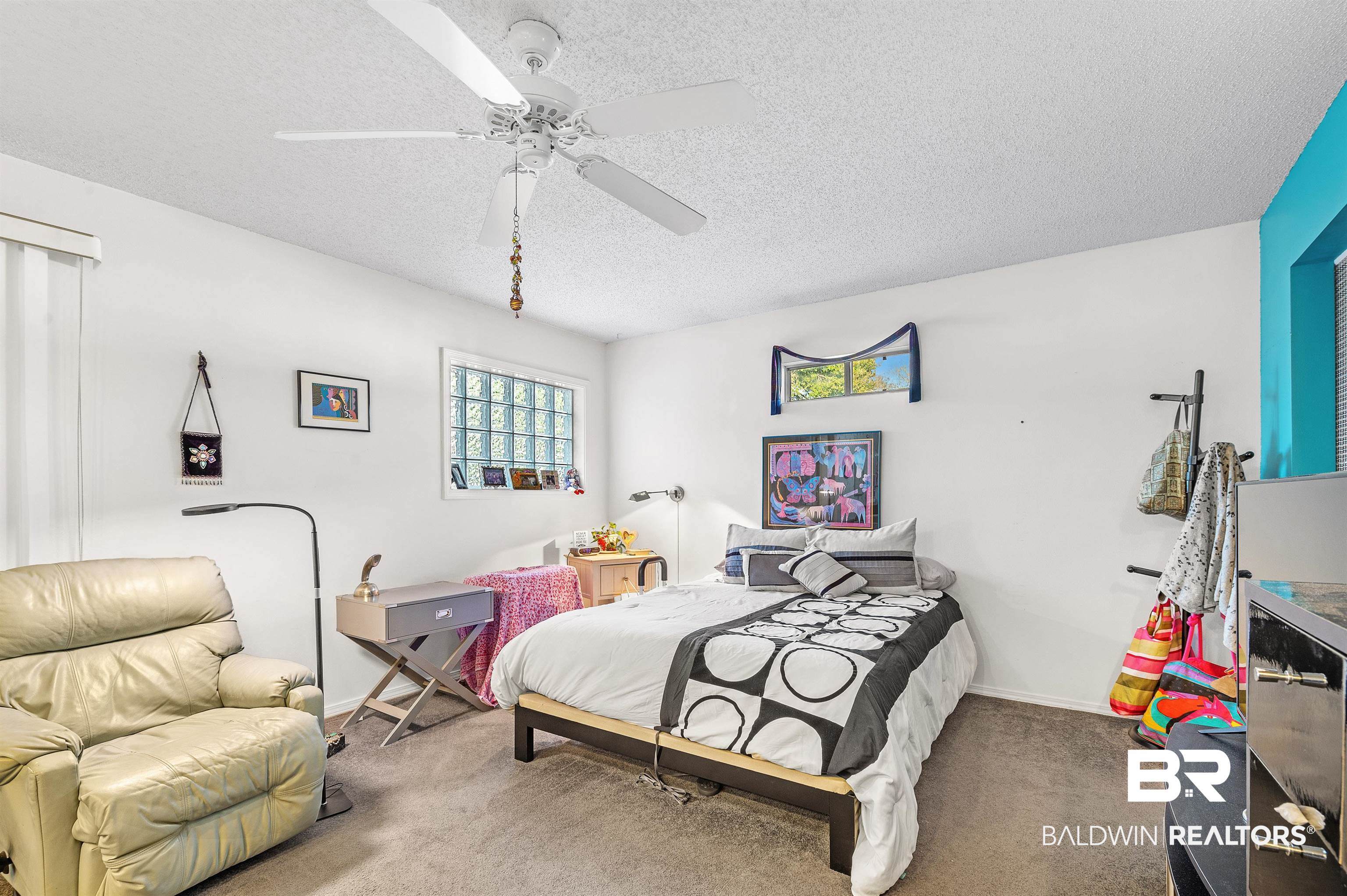 526 Ariel Avenue Foley, AL 36535 - Photo 26 of 33 Bedroom with ceiling fan, carpet floors, and a textured ceiling