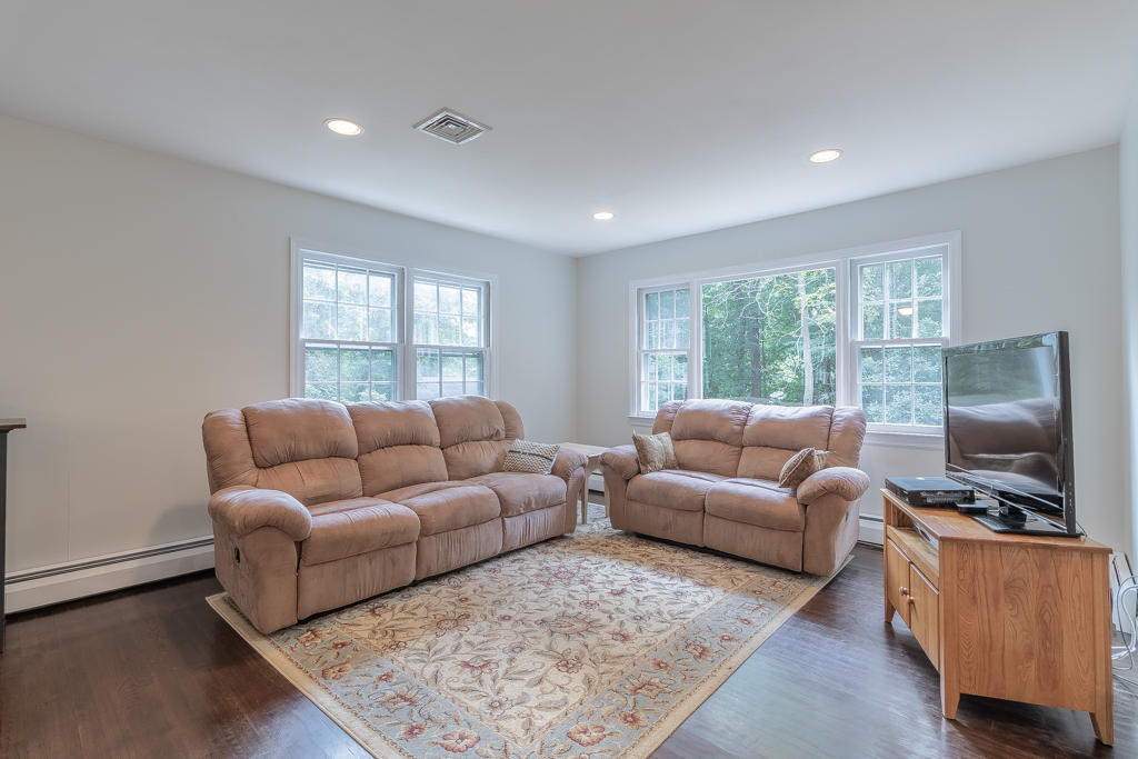 3 Hollow Spring Road Norwalk, CT 06854 - Photo 12 of 30 a living room with furniture and a flat screen tv