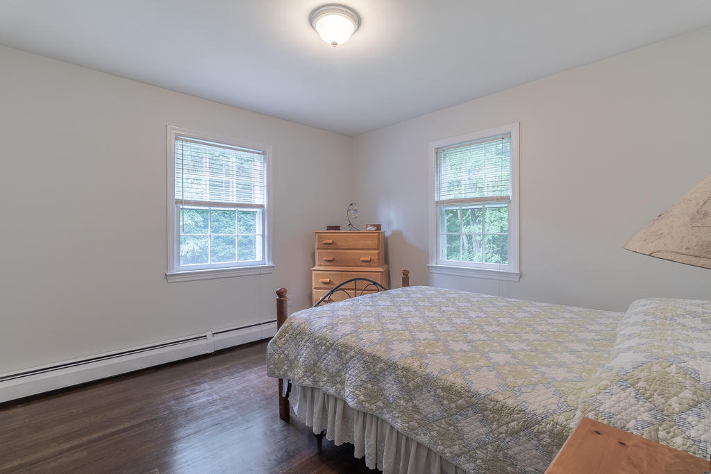 3 Hollow Spring Road Norwalk, CT 06854 - Photo 17 of 30 a bedroom with a bed and a window