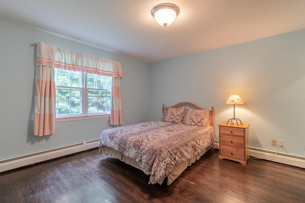3 Hollow Spring Road Norwalk, CT 06854 - Photo 18 of 30 a bedroom with a bed and a window