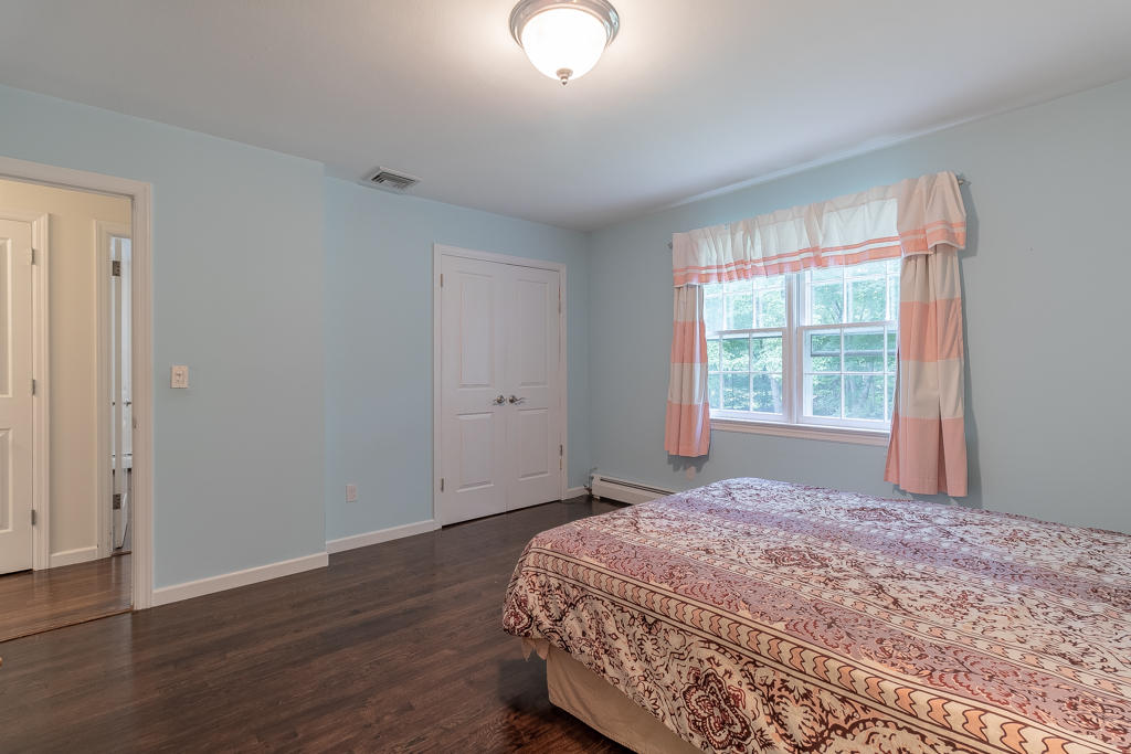 3 Hollow Spring Road Norwalk, CT 06854 - Photo 19 of 30 a bedroom with a bed and a window