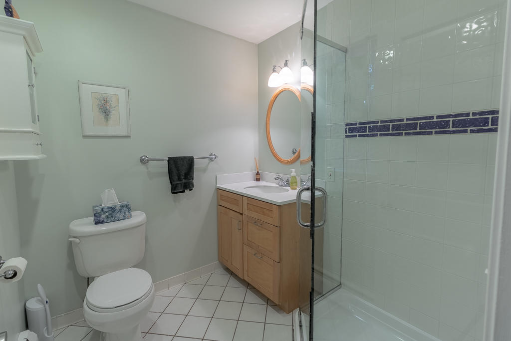 3 Hollow Spring Road Norwalk, CT 06854 - Photo 20 of 30 a bathroom with a toilet sink vanity and mirror