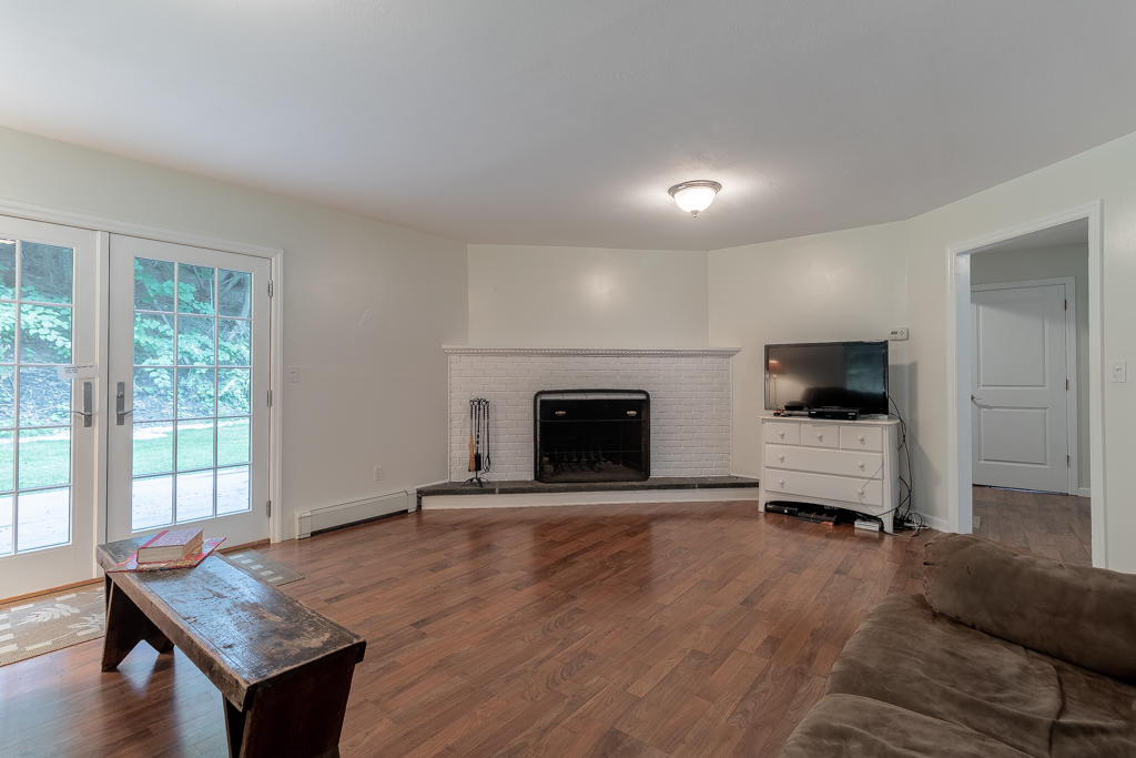 3 Hollow Spring Road Norwalk, CT 06854 - Photo 21 of 30 a living room with furniture and a fireplace