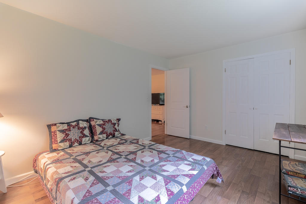 3 Hollow Spring Road Norwalk, CT 06854 - Photo 23 of 30 a bedroom with a bed and cabinets
