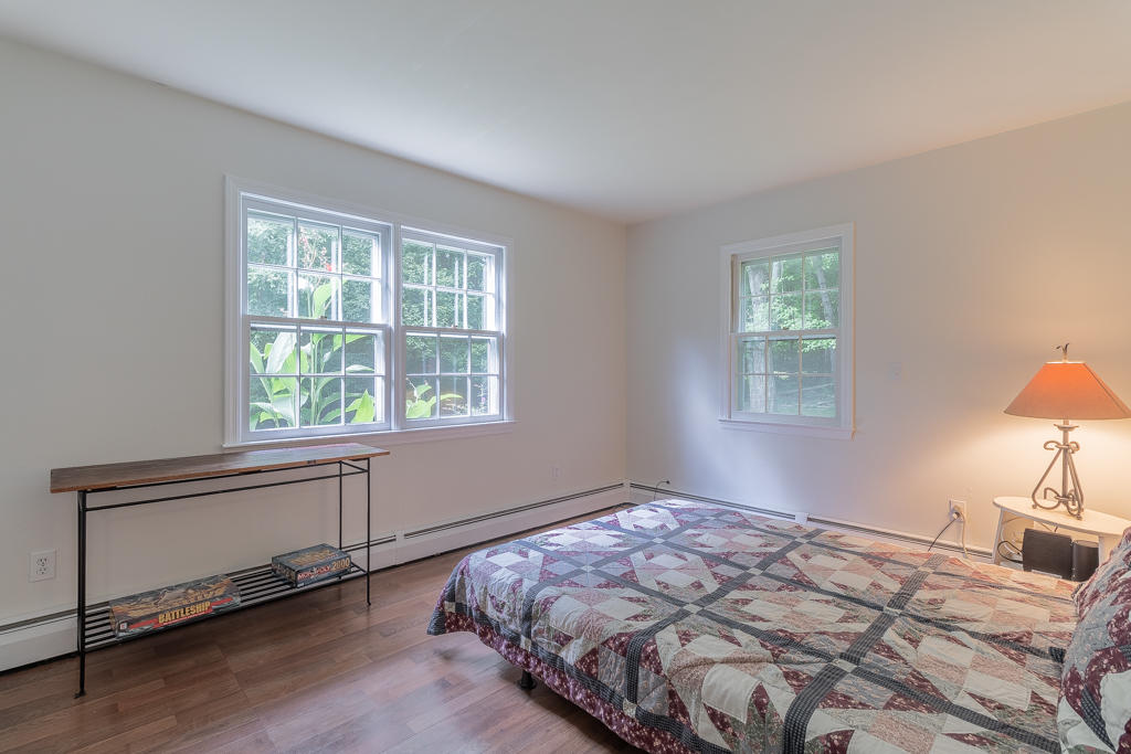 3 Hollow Spring Road Norwalk, CT 06854 - Photo 24 of 30 a bedroom with a bed and a window