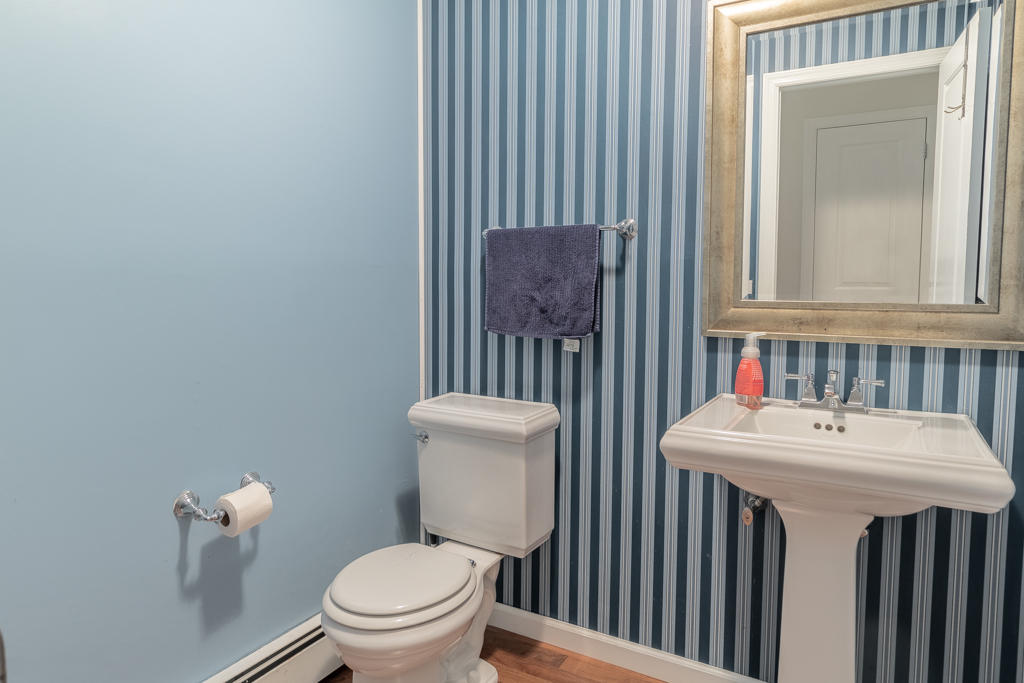 3 Hollow Spring Road Norwalk, CT 06854 - Photo 25 of 30 a bathroom with a toilet a sink and a mirror