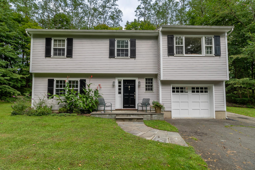 3 Hollow Spring Road Norwalk, CT 06854 - Photo 27 of 30 a front view of a house with a yard