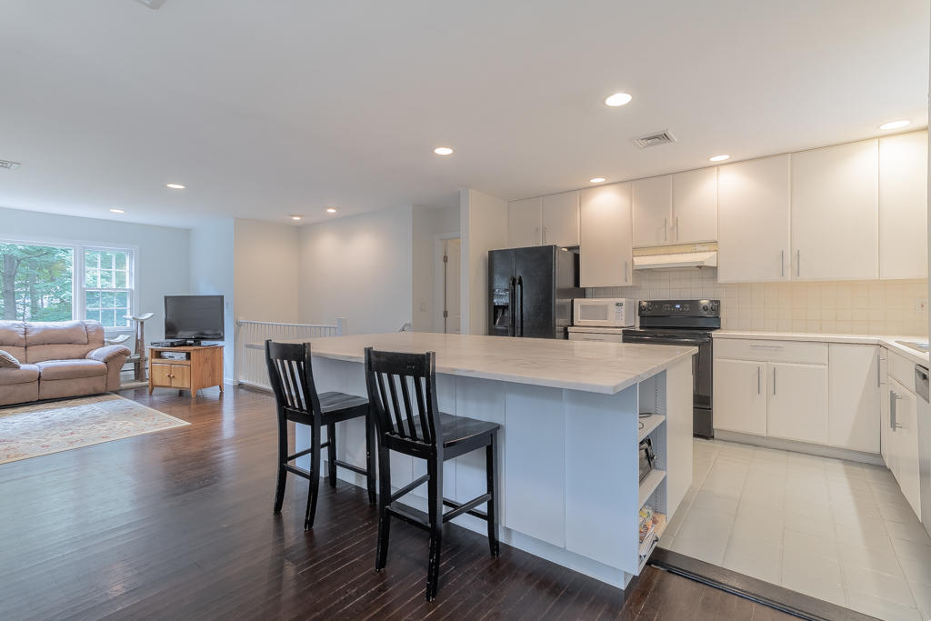 3 Hollow Spring Road Norwalk, CT 06854 - Photo 9 of 30 a kitchen with a table and chairs in it