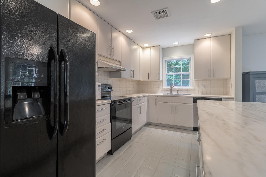 3 Hollow Spring Road Norwalk, CT 06854 - Photo 10 of 30 a kitchen with a refrigerator and a sink