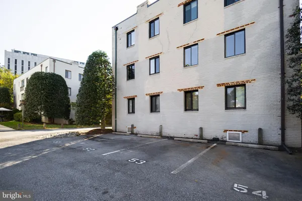 a view of a chairs and table in a backyard