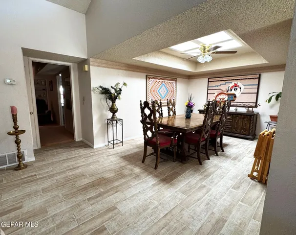 a bathroom with a sink a toilet a mirror and shower