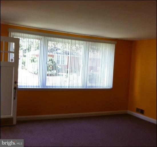 8125 Ridgely Oak Road Parkville, MD 21234 - Photo 8 of 13 an empty room with a window
