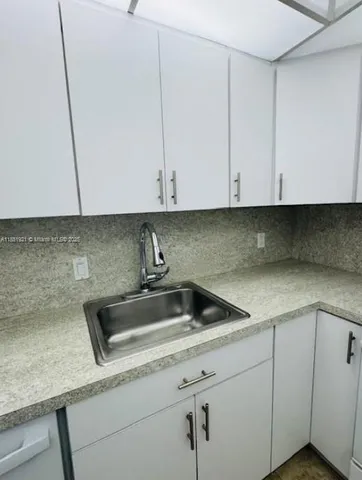 a bathroom with a toilet mirror and vanity