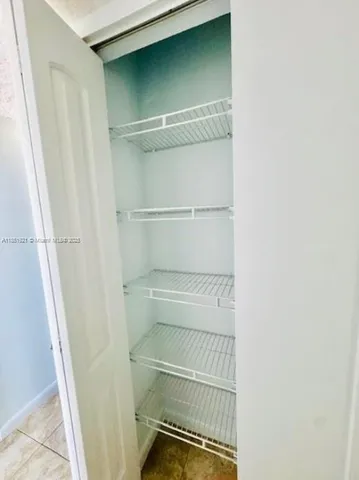 a front view of a building with garage