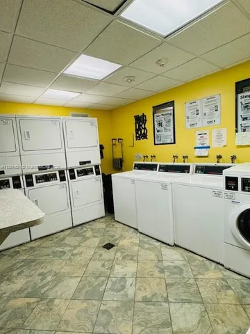 a view of an empty room with a chandelier