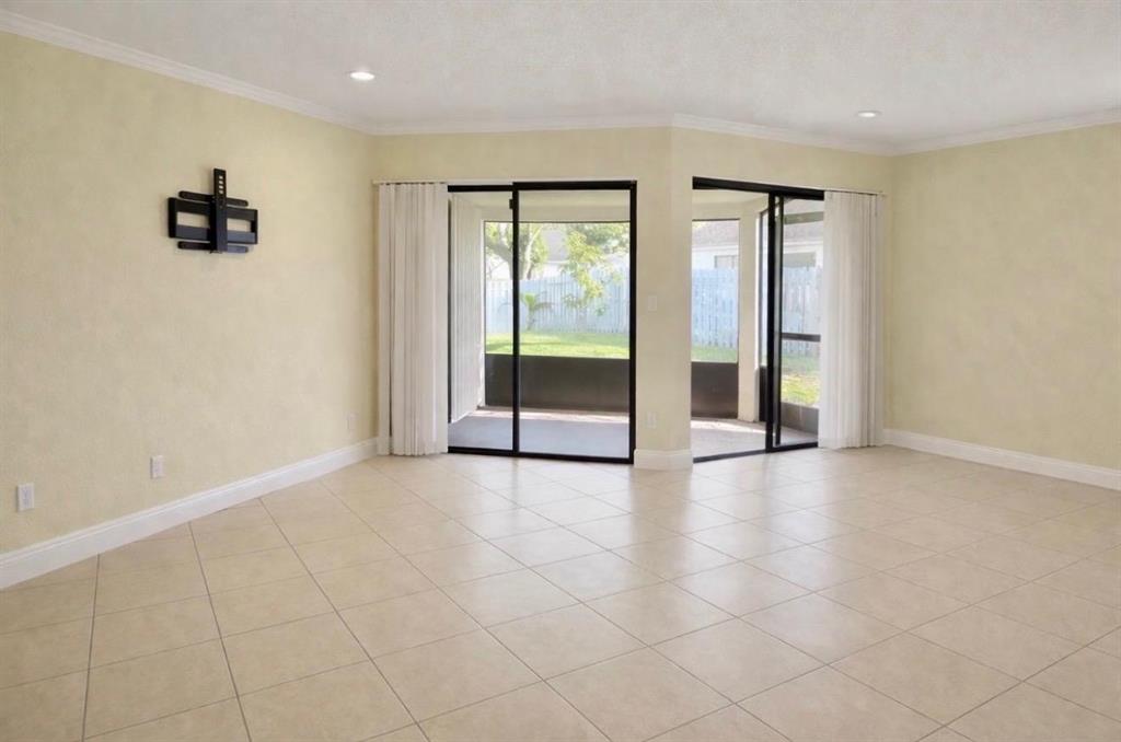 9616 Golf State Park Way Boca Raton, FL 33428 - Photo 17 of 22 wooden floor in an empty room with a window