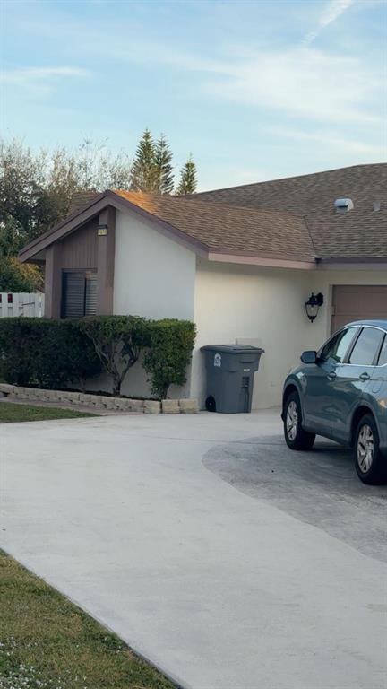 9616 Golf State Park Way Boca Raton, FL 33428 - Photo 3 of 22 a car parked in front of a house
