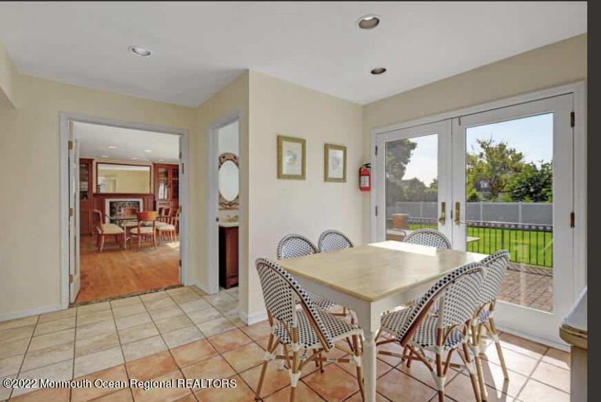 112 Roseld Avenue Deal, NJ 07723 - Photo 14 of 39 a view of a dining room with furniture window and outside view