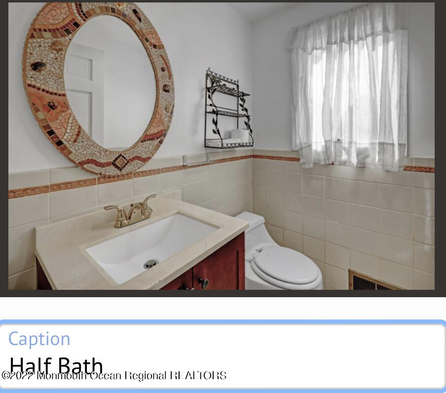 112 Roseld Avenue Deal, NJ 07723 - Photo 15 of 39 a bathroom with a sink mirror and toilet