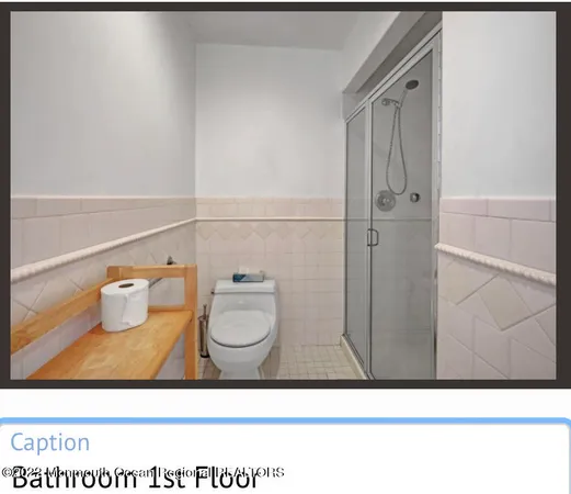 a bathroom with a toilet and a sink