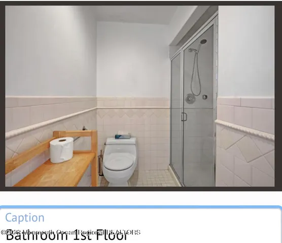 a bathroom with a toilet and a sink