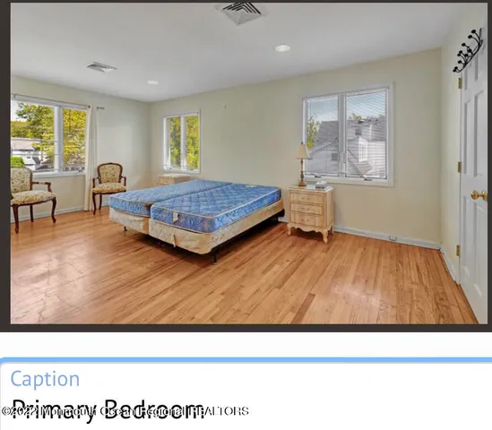 a living room with a wooden floor