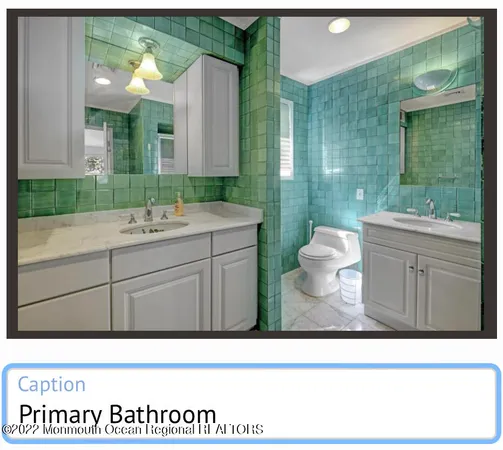 a bathroom with a sink mirror and toilet