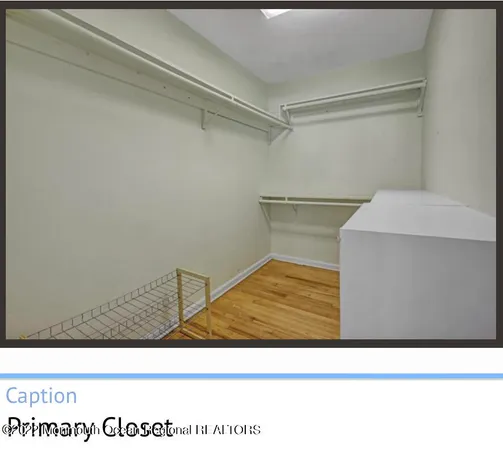 a view of a room with furniture and windows