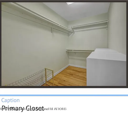 a view of a room with furniture and windows