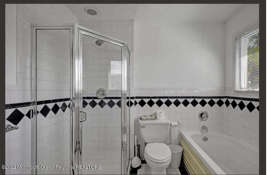 112 Roseld Avenue Deal, NJ 07723 - Photo 27 of 39 a bathroom with a shower a toilet and a sink