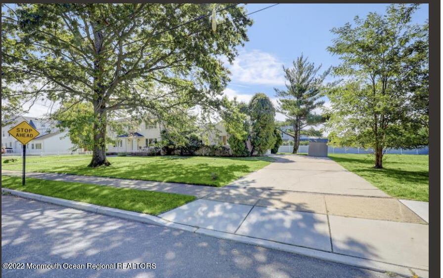 112 Roseld Avenue Deal, NJ 07723 - Photo 3 of 39 a view of a park with plants and trees