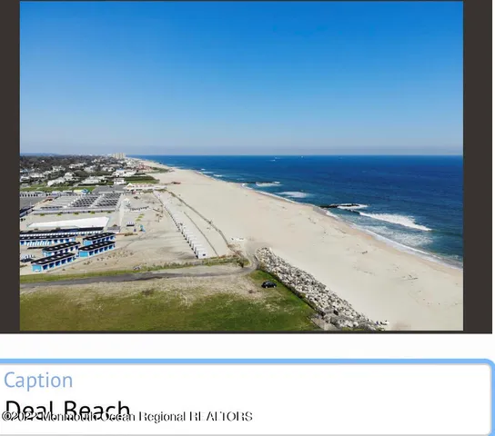 a view of swimming pool with lawn chairs and large trees