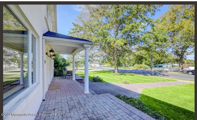 a view of a pathway with a yard