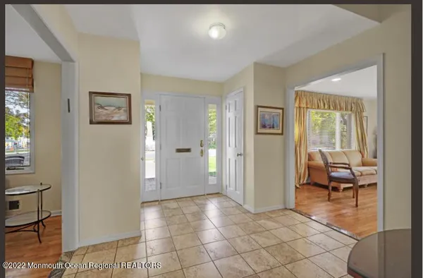 a view of a livingroom with furniture and front door