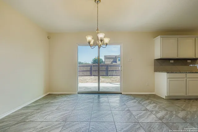 a view of a storage & utility room with a window