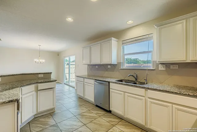 a kitchen with a sink and cabinets