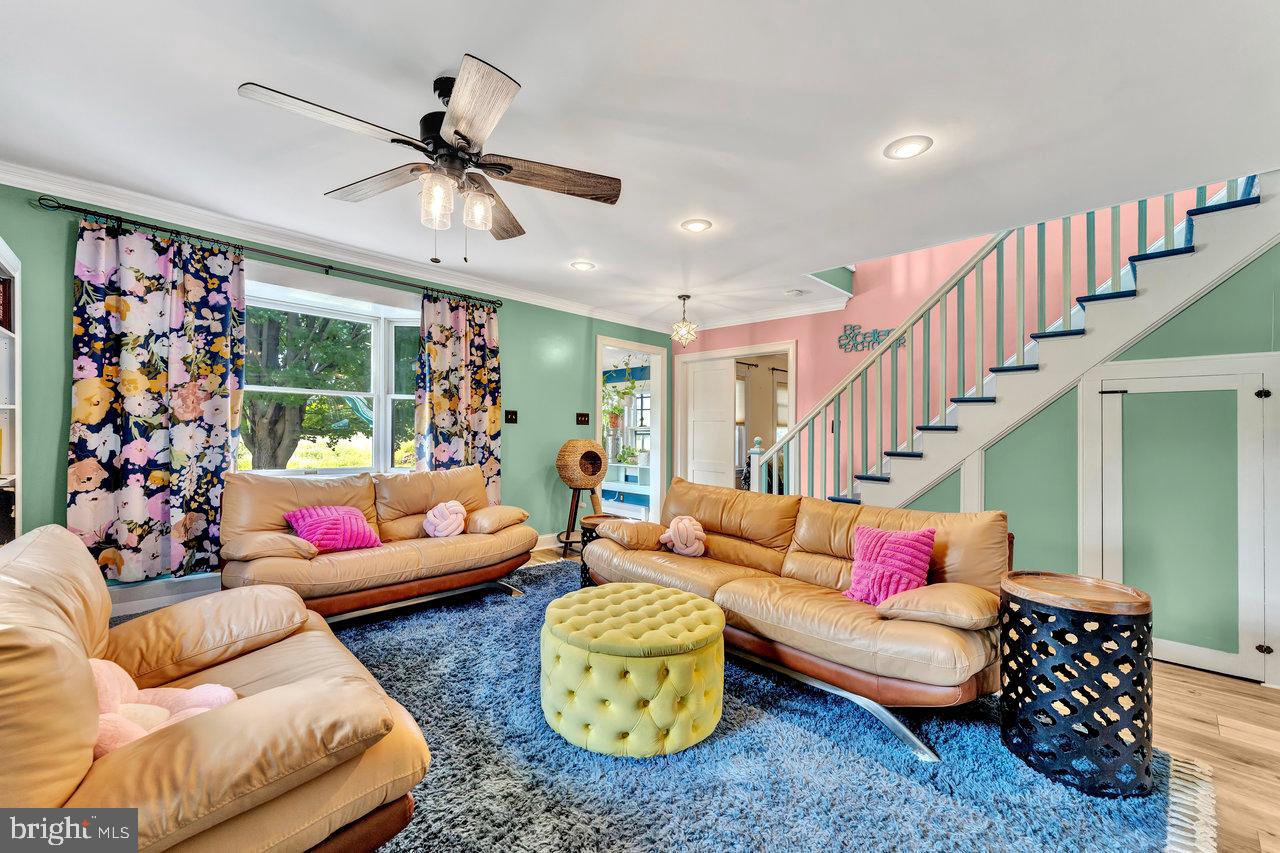 254 Friendship Road Cranbury, NJ 08512 - Photo 13 of 44 a living room with furniture and a chandelier