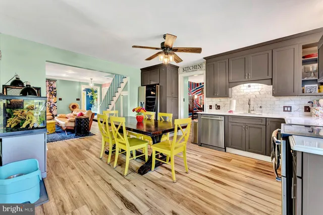 a view of a dining room with furniture and wooden floor