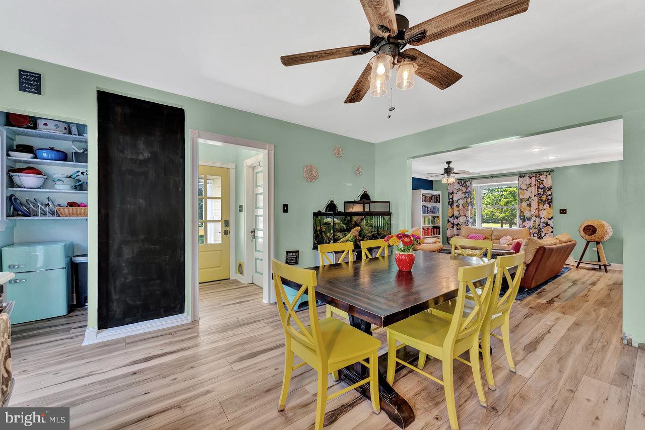 254 Friendship Road Cranbury, NJ 08512 - Photo 15 of 44 a view of a dining room with furniture and wooden floor